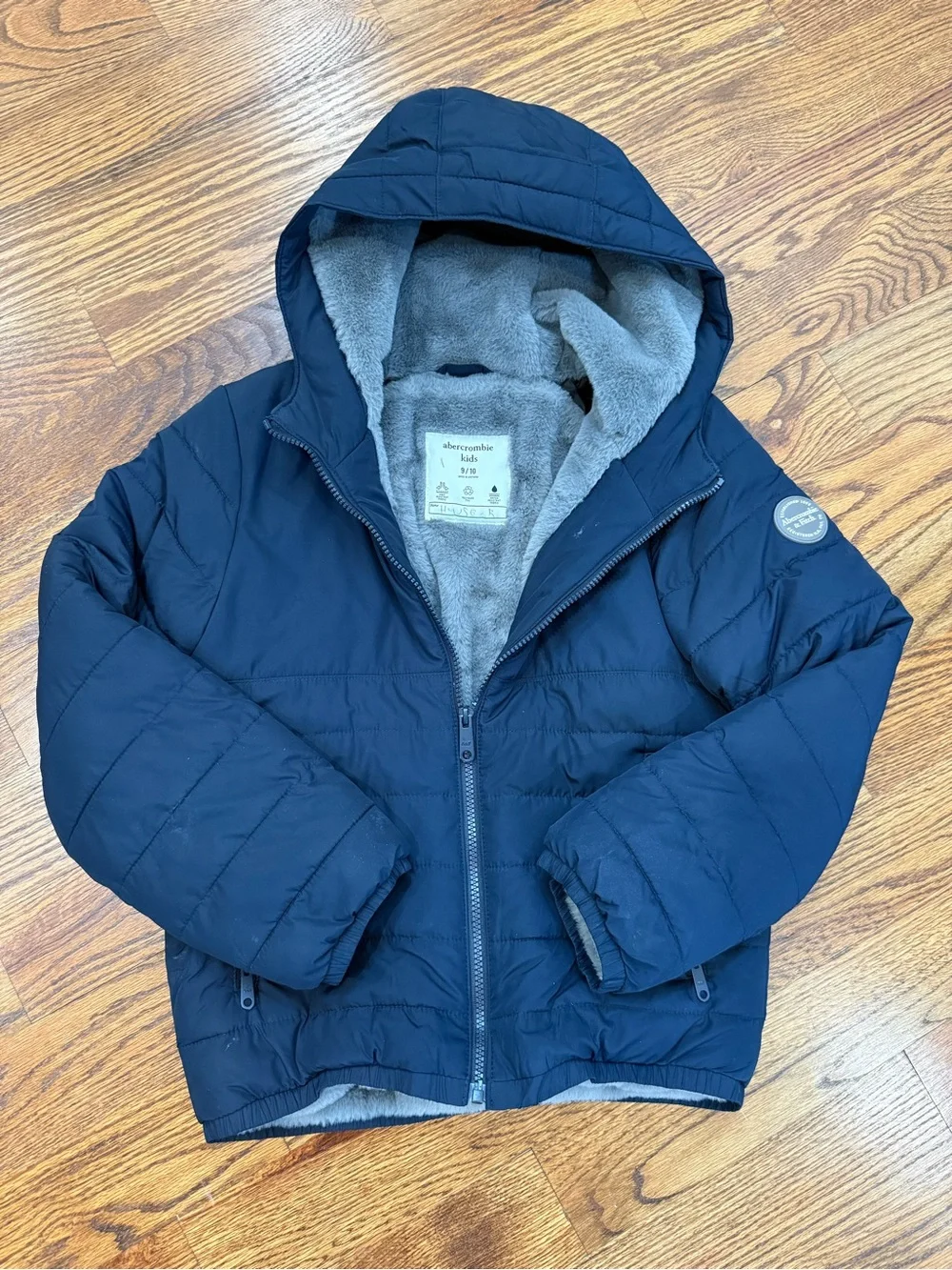 abercrombie kids navy puffer jacket with hood and gray lining
